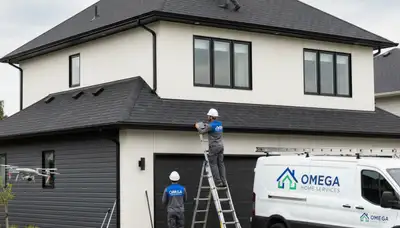 Professional roof inspection on Spokane, WA home exterior by Next Level Exteriors siding experts